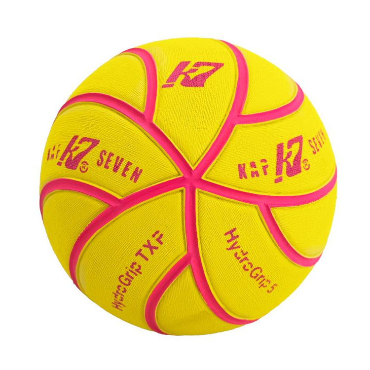 A yellow and pink Kap7 HydroGrip water-polo ball on a solid white background.